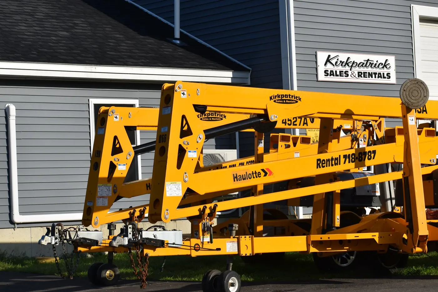 Haulotte scissor and boom lifts parked together at the Kirkpatrick rental yard.